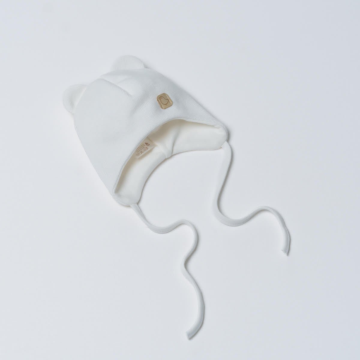 Vilaurita Medvilninė šilta kepurė naujagimiui - Balta - Uogų kopos