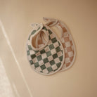 Mushie Muslino seilinukai 2vnt. - Alyvuogių spalvos langeliai - Uogų kopos